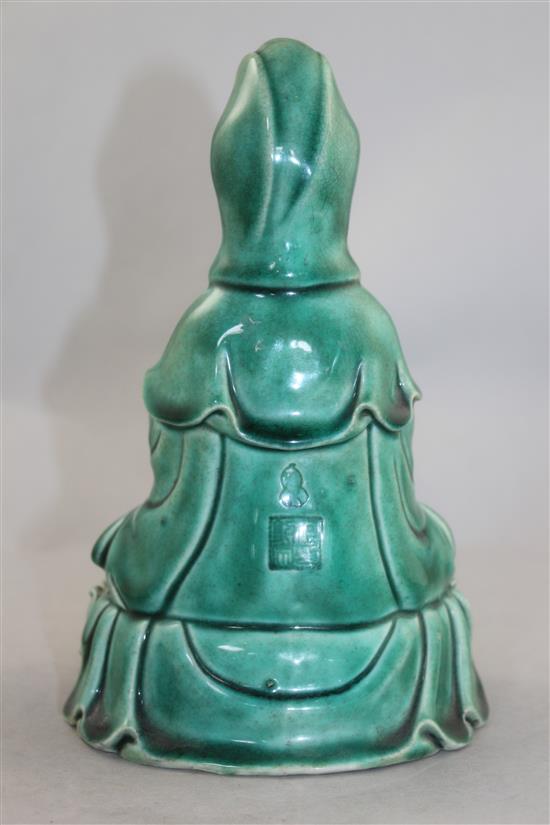 A Chinese green glazed biscuit porcelain seated figure of Guanyin, 12cm